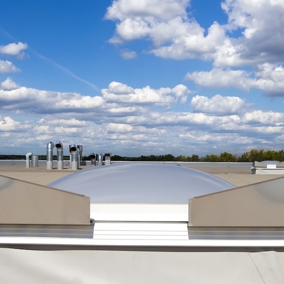TPO roof system with fluffy clouds in the background