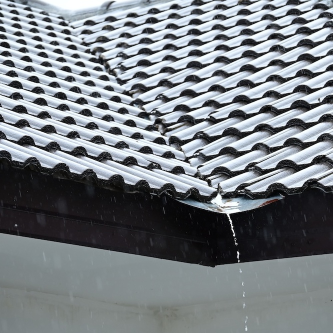 Water is trickling through a tile roof system.